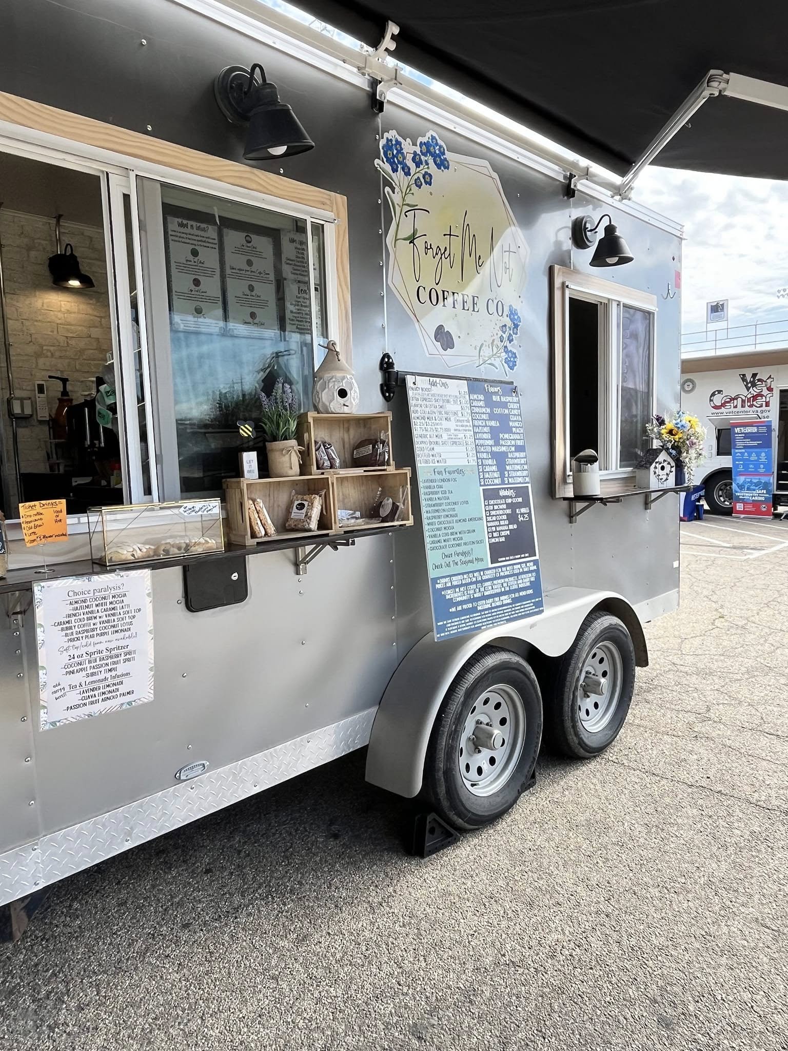Food truck rally at Jordan's Garden Center with several food trucks and people around